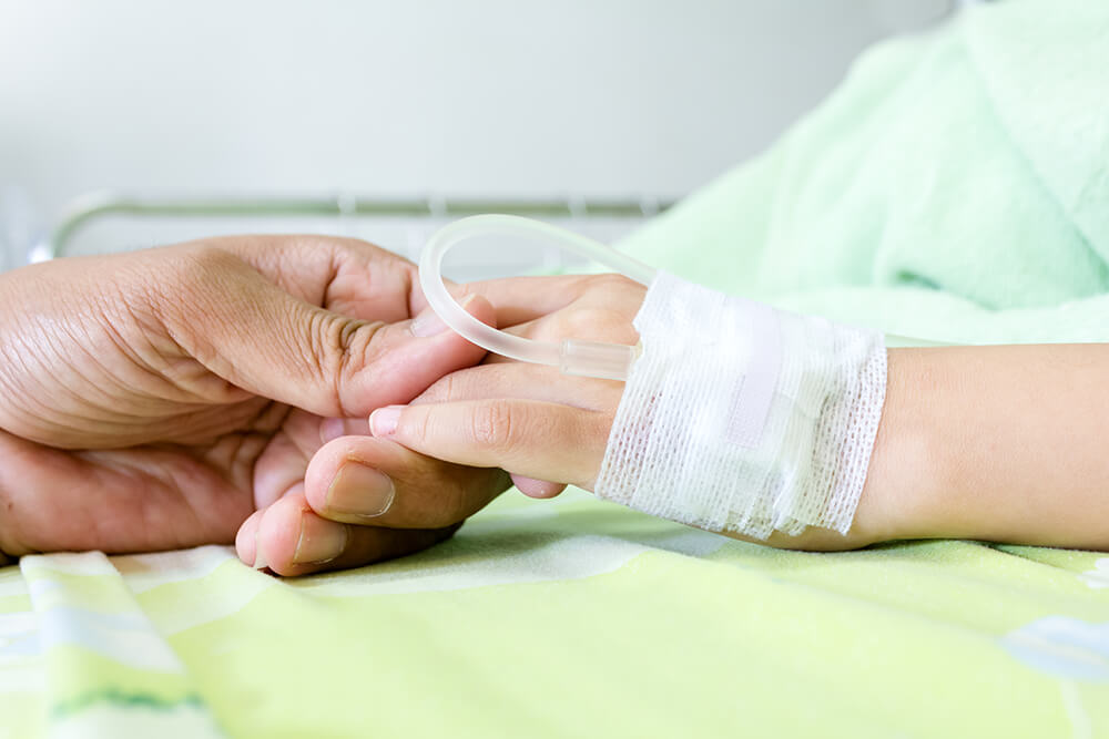 hospital bed holding hands